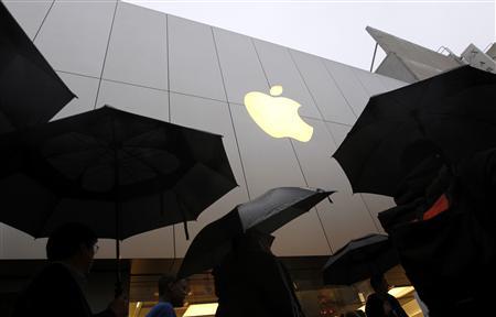 Customers enter the Apple flagship retail store to purchase the new iPad in San Francisco