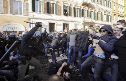 Feyenoord fans clash with police at the Spanish Steps prior to the start of the Europa League soccer match between Roma and Feyenoord in Rome