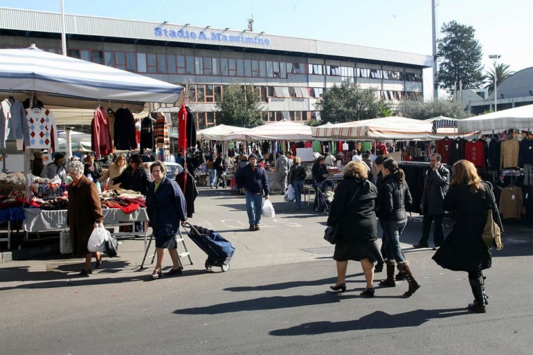 A small market is seen on the square out